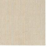 Top-down detail of striped pattern and alternating wool and jute fibers