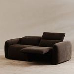 Angled view of charcoal brown recliner sofa with right seat footrest extended and backrest raised