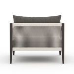Rear view showing straight chair legs and woven back detail on white background