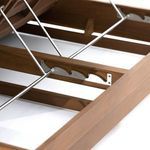 Metal hinge mechanism and wooden slat supports visible under open adjustable backrest