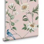 Close-up view of Nuit Blush wallpaper showing detailed white flowers and a single perched blue bird on a soft pink backdro...