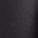 Macro close-up of matte black ceramic surface highlighting subtle texture and matte finish