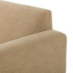 Close-up on back corner seam and armrest of Ethel Sofa fabric in light tan poly-linen