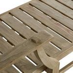 Close-up showing armrest dowel joint over teak wood slats on chaise lounge frame