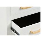 Close-up showing smooth black interior bottom of an open drawer with gold handle