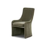 Blaire Dining Chair angled view showing curved armrests and seamless upholstery in olive green