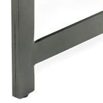 Tufted leather surface viewed closely to highlight texture and fading on ebony finish