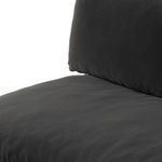 Close-up of cushion seam and fabric on sofa's seat and back pillow