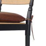 Detail close-up of leather strap tying cushion to chair frame on Fayth stool