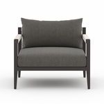 Front view showing wide dark cushion and squared frame with rope detail on armrests