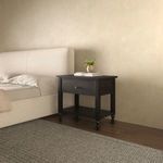 Angled view of Katherine nightstand in bedroom setting showing drawer, shelf, and decorative elements