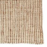 close-up of ribbed woven texture highlighting soft fibers in light tan and white colors