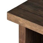 Detailed corner close-up showing layered plank edges and wood texture