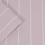 Close-up of wallpaper roll highlighting narrow pale stripes and smooth texture