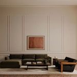 Garnet Lounge Chair paired with sectional sofa and coffee table in elegant living room