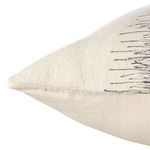Side angle showing textured fabric and embroidery details with visible pillow edge stitching