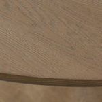 Macro detail of weathered oak wood grain on table surface texture.