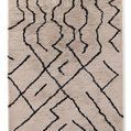 Beige shag outdoor rug with black irregular geometric lines inspired by Beni-style Moroccan design