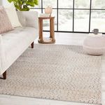 Melora Dots rug styled in modern living room beside beige sofa and wooden side table