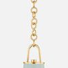 Close-up of gold chain links connecting pendant to suspension hardware
