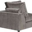 Rear side angle showing smooth velvet texture and bolstered pillow on arm of the sectional corner