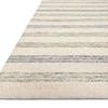 Close-up side view showing thickness and edge of the Chris Ivory Slate Rug
