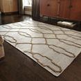 Adler Slate Rug displayed in a living room setting on dark wood floors with mid-century modern furniture