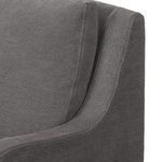 Close detail of banquette's armrest showing fabric weave and cushion overlap
