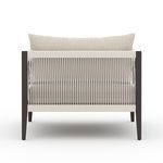Back of chair featuring vertical woven detail on bronze frame