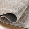Folded corner of the rug revealing the soft pile texture and power-loomed construction