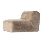 Side view of the pewter shaggy accent chair showing its height and armless design