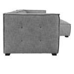 Side profile highlighting tufted armrest and fabric texture close-up