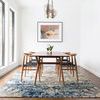 Same dining scene with different wall art above table, showing rug’s pattern versatility in room context