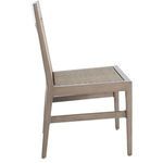Side view of chair frame with woven raffia panels and aluminum oak finish