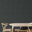 Wallpaper installed on dining room wall with light wood table and chairs, showing room context
