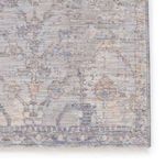 close-up of rug edge highlighting intricate vintage medallion details and soft fiber texture