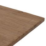 Close-up of table surface showing pine wood texture and natural knots