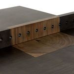 Back view focusing on trapezoidal wood base and table top edge