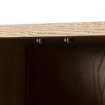 Interior underside showing small metal components attached to cabinet bottom.