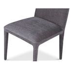 Close-up angled view of seat cushion and front legs of single Calla dining chair