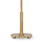 Close-up of natural brass daisy-shaped lamp base with rounded feet