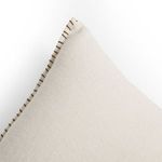 Top corner close-up of Calvin Outdoor Pillow emphasizing hemp fabric texture and hand-stitched border