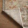 Back of rug folded over, exposing the woven underside and subtle color contrast