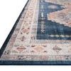 Close-up angled view showing rug’s textured power-loomed polyester surface and detailed medallion patterns