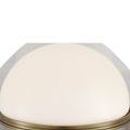 Close-up of glossy white glass dome shade on Promenade brass table lamp