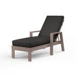 Laguna Chaise Lounge with hand-brushed driftwood-look aluminum frame and black cushioned seat and backrest