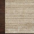 Corner close-up of Jamie Natural Sand Rug on dark wood floor showing the woven grid pattern and fiber texture
