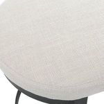Close-up of the off-white textured linen blend fabric seat with visible weave pattern