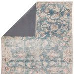Bardia rug partially flipped to show dark gray backing