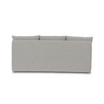 Back view displaying smooth, fitted slipcover on banquette frame